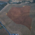 Aerial photo of partially swathed field at harvest