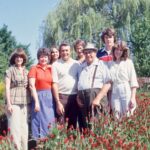 Historical photo of the Berger family standing in a crimson clover field